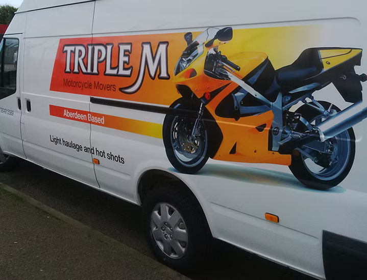 Branded fleet of vans with Inspire Signs graphics